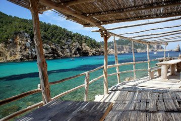 Benirras Bay.Coastal terrace of natural materials.Ibiza Island.Spain.	