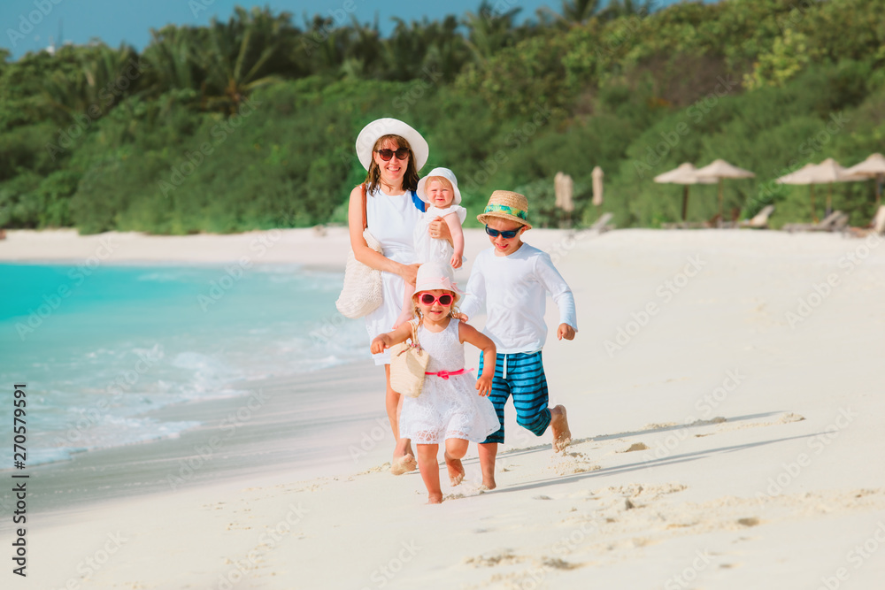 Wall mural happy family with kids have fun on tropical beach