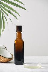 Obraz premium Spa cosmetics in brown glass bottles on gray concrete table. Copy space. Beauty blogger, salon therapy, minimalism concept