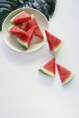 Tasty fresh appetizing watermelon slice and drink smoothie on isolated white background, top view