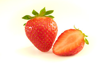 Strawberry and half strawberry on white background