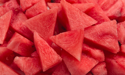 Red seedless watermelon pieces variety, summer food background