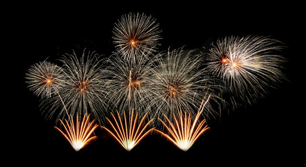 International fireworks festival display at night. Variety of colorful fireworks in holidays celebration isolated on black. Happy New Year Background. © tampatra