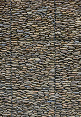 gabion wall of round pebbles with metal mesh