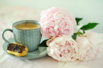 Cup of coffee with peony