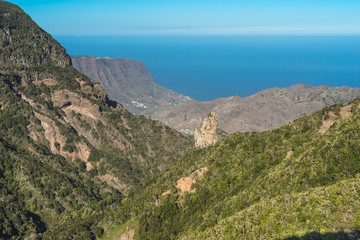 Fototapeta na wymiar View down to over the Garajonay National Park to the Monteforte gorge, Spanish, the Barranco del Monteforte, to the valley of Hermigua on the Canary island of La Gomera