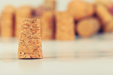Heap of assorted wine corks on wooden background