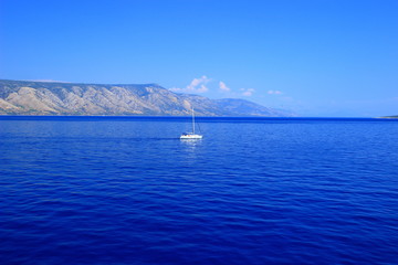 Sailing boat near islands Brac and Hvar on Adriatic sea in Croatia