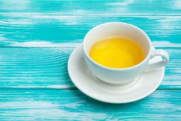 healthy herbal tea over blue background