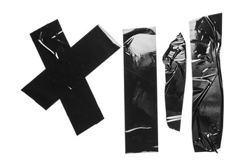 Torn different size black sticky tape, adhesive pieces