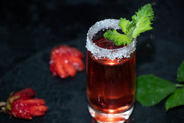 glass of strawberry juice with berries