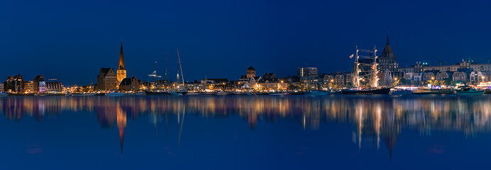 Rostock night panoramic. Warnow canal with ships and Baltic Sea in Rostock Germany in Hanse Sail Festive