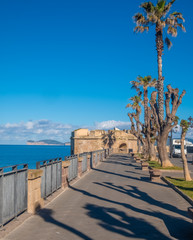 Fototapeta premium Gorgeous sea font and ramparts, Alghero (L'Alguer), province of Sassari , Sardinia, Italy. Famous for the beauty of its coast and beaches and its historical city center.