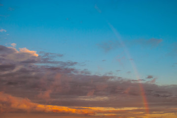Fototapeta premium faint rainbow at sunset