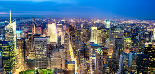 Tall skyscrapers of Midtown Manhattan, night aerial view