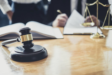 Male lawyer or Counselor working in courtroom have meeting with client are consultation with contract papers of real estate, Law and Legal services concept