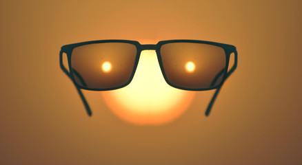 flying sunglass at sunset