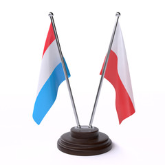 Luxembourg and Poland, two table flags isolated on white background. 3d image