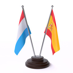 Luxembourg and Spain, two table flags isolated on white background. 3d image