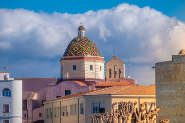 Majolica tiled cupola of Jesuit church of San Michele, Alghero (L'Alguer), Sardinia, Italy.  Famous for the beauty of its coast and beaches and its historical city center.