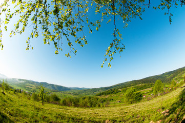 beautiful mountain valleys and mountains on a bright sunny day on the background of a wide valley