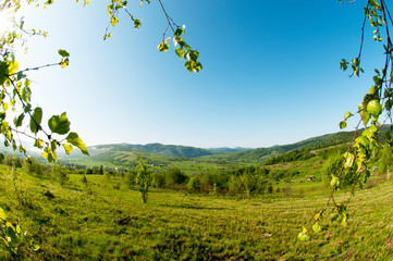 beautiful mountain valleys and mountains on a bright sunny day on the background of a wide valley