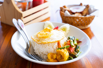 stir fried curry with shrimp and fried egg