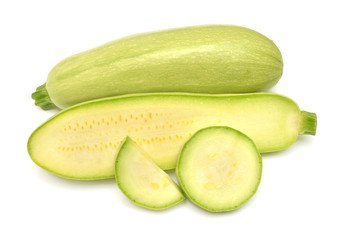 Fresh squash vegetable marrow zucchini whole, half and rings isolated on white background. Flat lay, top view