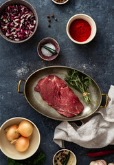 Raw steak with ingredients for cooking healthy food top view