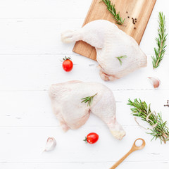 Fresh raw chicken legs with herbs. Cooking concept