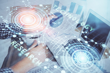 Multi exposure of technology hologram with man working on computer background. Concept of big data.