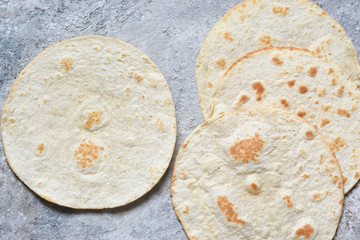 Mexican corn tortillas for sentencing tacos, quesadilla, fajitos, tortilla. View from above.