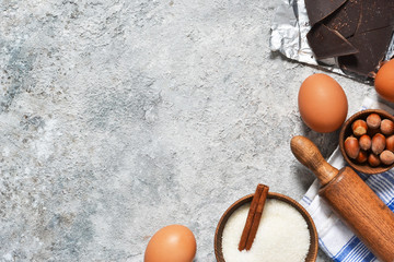 Ingredients for baking: flour, sugar, eggs, spices. Top view.