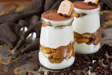Italian dessert tiramisu on an old grunge background