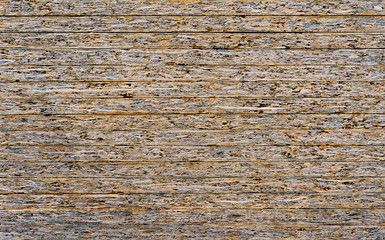 Chipboard background. Rough plywood texture. Plate of compressed sawdust.