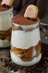 Italian dessert tiramisu on an old grunge background