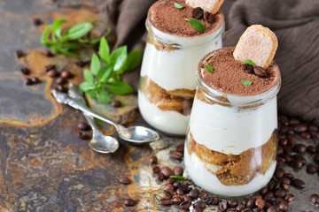 Italian dessert tiramisu on an old grunge background