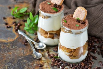 Italian dessert tiramisu on an old grunge background