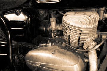 Old motorcycle motor engine in vintage photo