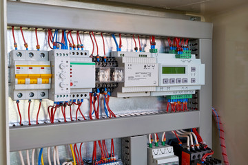 The display controller, power supply, relays, phase control, relay, automatic switch, level switch mounted in series in the electrical Cabinet. Electrical wires are connected according to the diagram.