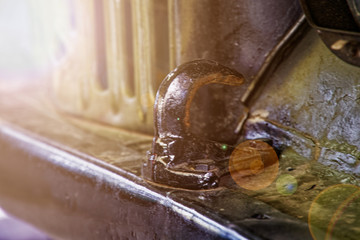 Military truck radiator grille and steel tow hook.