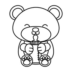 toy bear holding a feeding bottle black and white