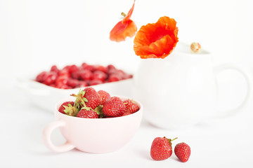 vegetarian and vegan food: strawberries and cherries on a white background, ecological clean products
