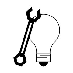Bulb light and wrench symbols in black and white