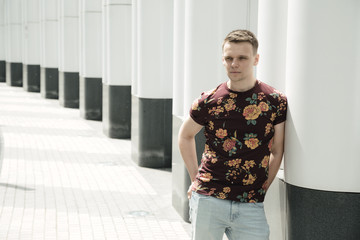  Fashionably dressed guy posing on the streets