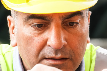 Close-up portrait of a concentrated civil engineer