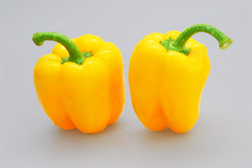 Yellow pepper isolated on a gray background