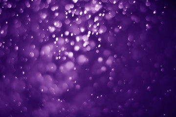 Obraz premium Bokeh purple proton background abstract
