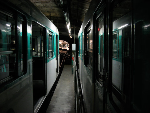 A photo of metro trains standing in a tunnel.