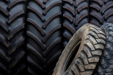 Close up several used black truck tires